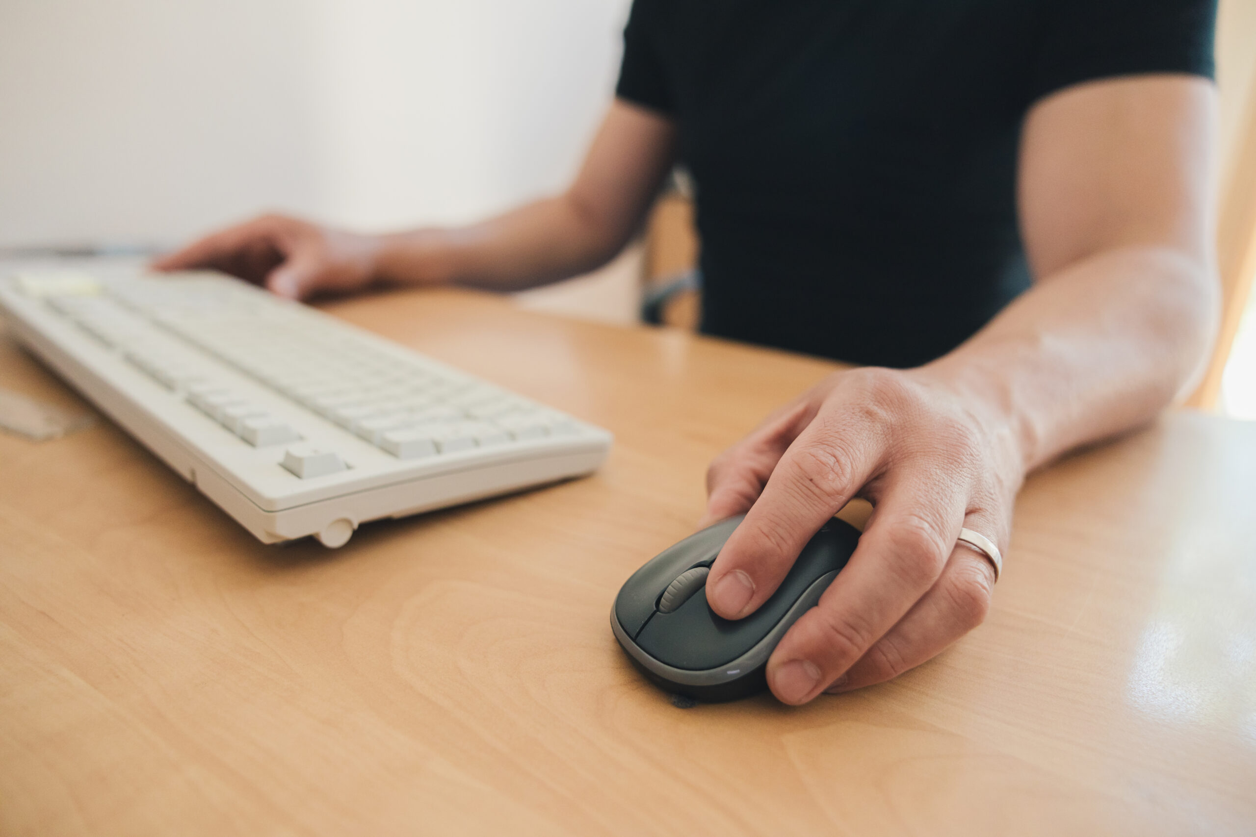 man working at desk with keyboard and mouse 2026 03 16 22 59 55 utc